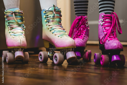 Pink and purple roller skates with striped socks