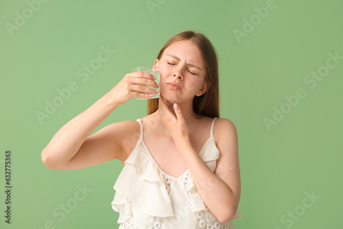Young woman with tooth ache...
