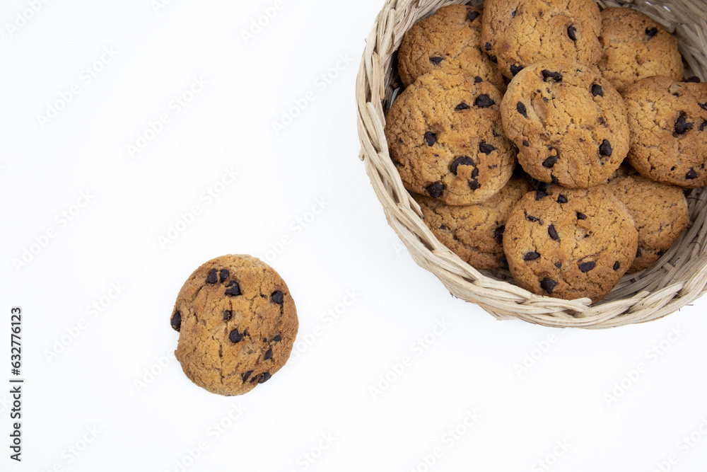 Chocolate chip cookies in a bamboo basket isolated on white background Chocolate chip cookies in a bamboo basket isolated on white background