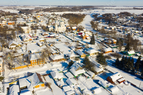 Aerial view of snow covered Venyov townscape with architectural ensemble of Orthodox church of Our Lady of Kazan and Epiphany church in winter, Tula Oblast, Russia