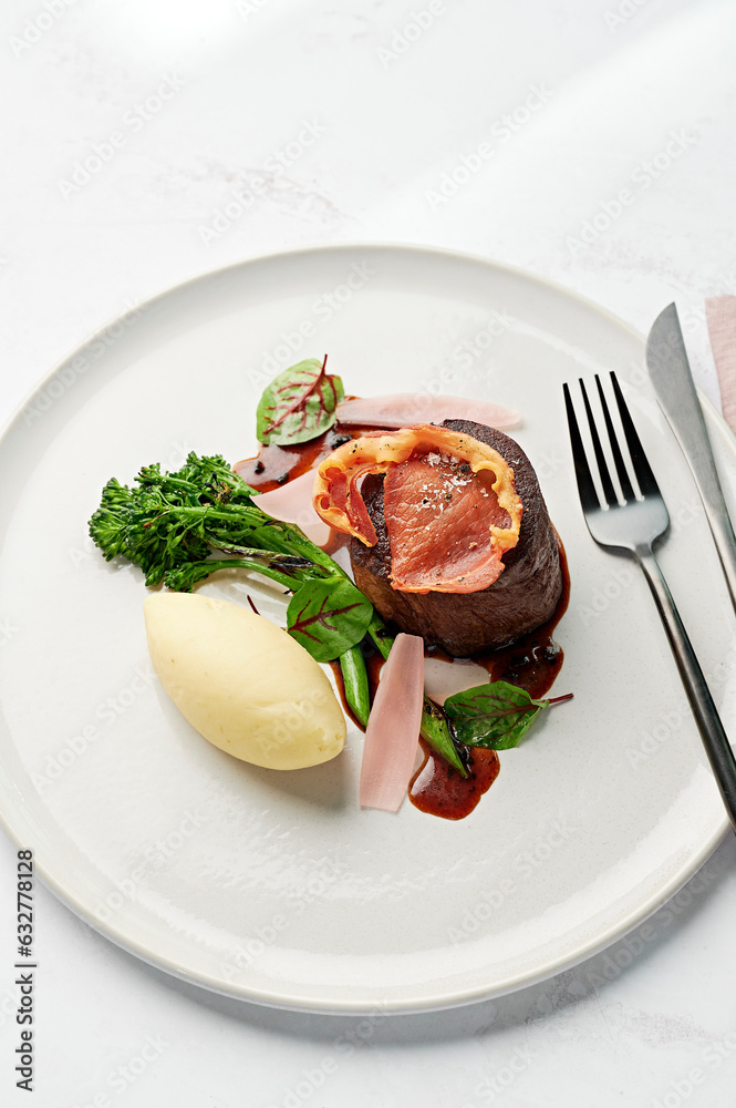 Eye fillet, mashed potato, charred broccolini, black truffle jus, pickled shallot petals, crisp