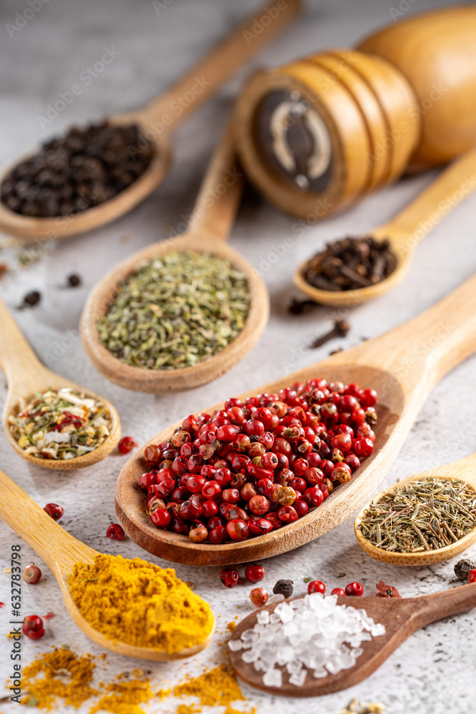 Various spices and seasonings in wooden spoons. Various spices and seasonings in wooden spoons.