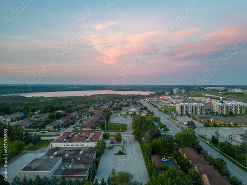 Stunning drone imagery of Barrie: traverse highways, Cundles Road, Highway 400; spotlight on real estate from skyscrapers to homes. A unique aerial insight into the city's evolving landscape photo