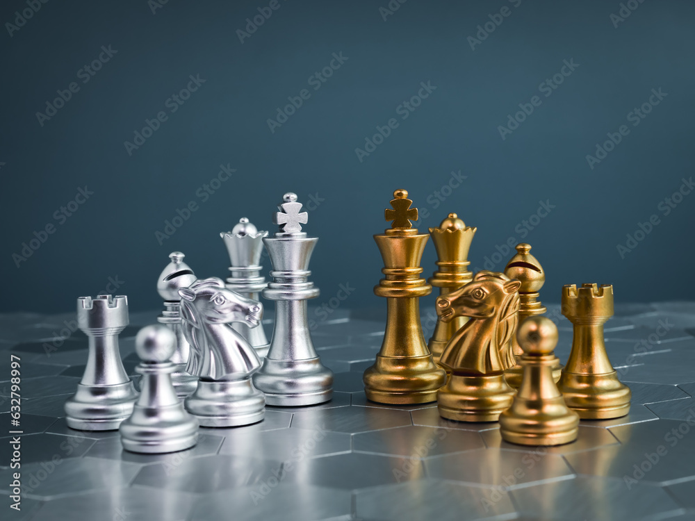 Set of golden and silver chess pieces element, king, queen rook, bishop, knight, pawn standing on hexagon pattern chessboard on blue background. Competition, game, war, emulation and planning concept. Set of golden and silver chess pieces element, king, queen rook, bishop, knight, pawn standing on hexagon pattern chessboard on blue background. Competition, game, war, emulation and planning concept.
