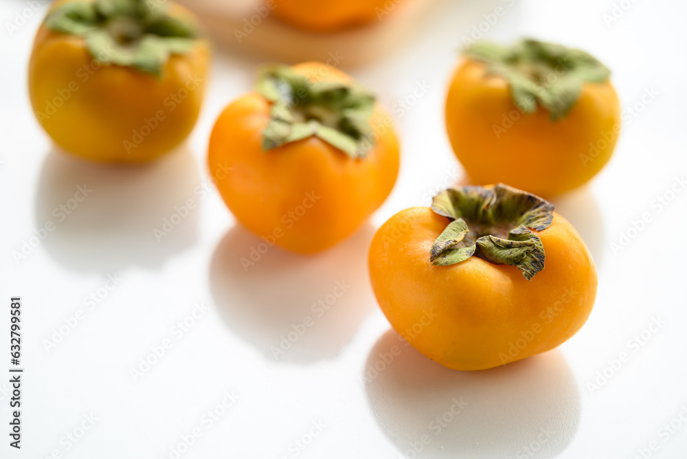 Fresh persimmon fruit in autumn season Fresh persimmon fruit in autumn season