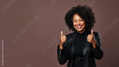 Confident senior businesswoman at work smiling with a thumb up