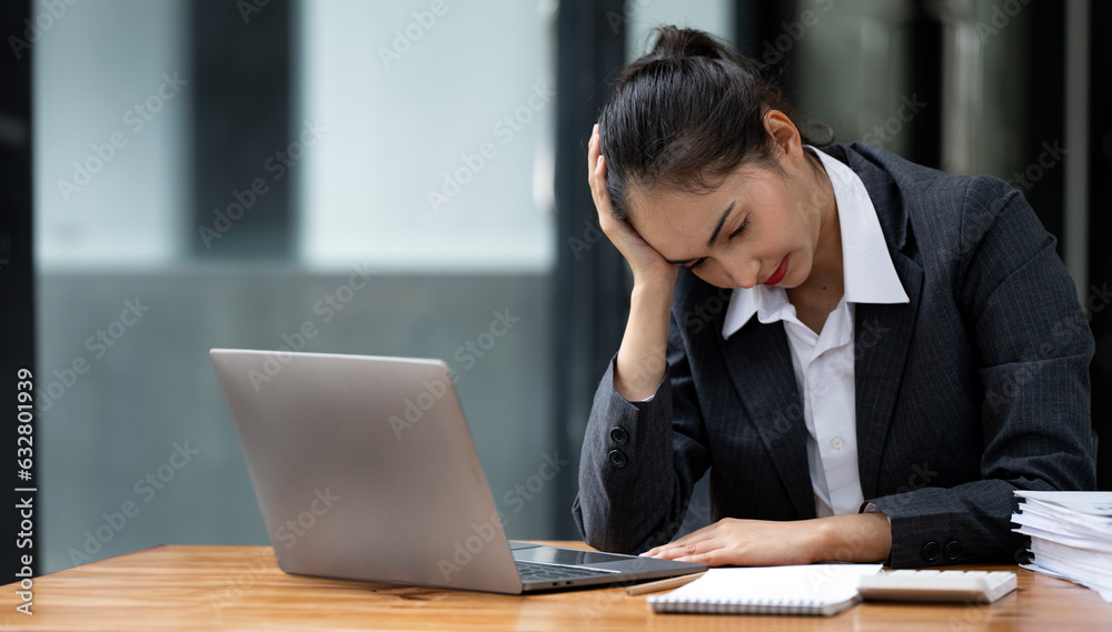 Tired business woman working on computer in modern office, headache. Tired business woman working on computer in modern office, headache.
