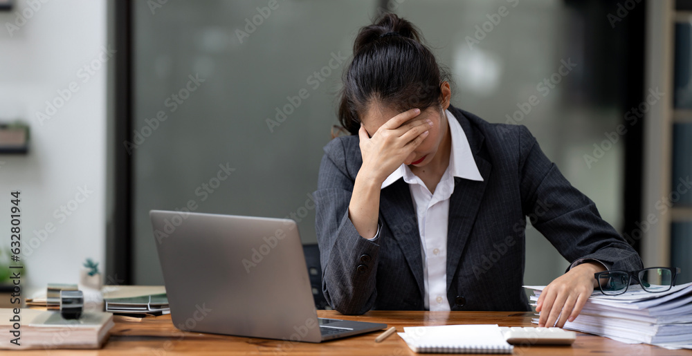 Tired business woman working on computer in modern office, headache. Tired business woman working on computer in modern office, headache.