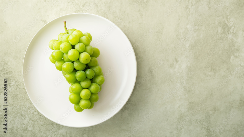 Shine Muscat, green grapes on a plate Shine Muscat, green grapes on a plate