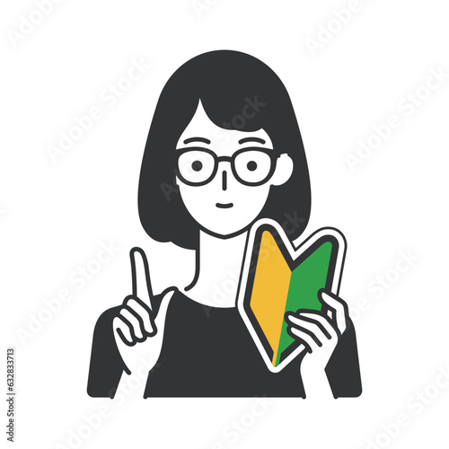 初心者マークを持つ女性