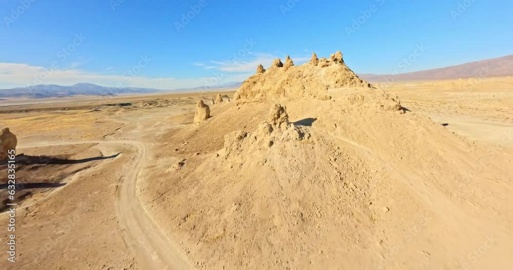 FPV drone captures the surreal beauty of Trona Pinnacles bathed in the warm hues of the golden hour. Unique landscape and cinematic appeal. FPV drone captures the surreal beauty of Trona Pinnacles bathed in the warm hues of the golden hour. Unique landscape and cinematic appeal.