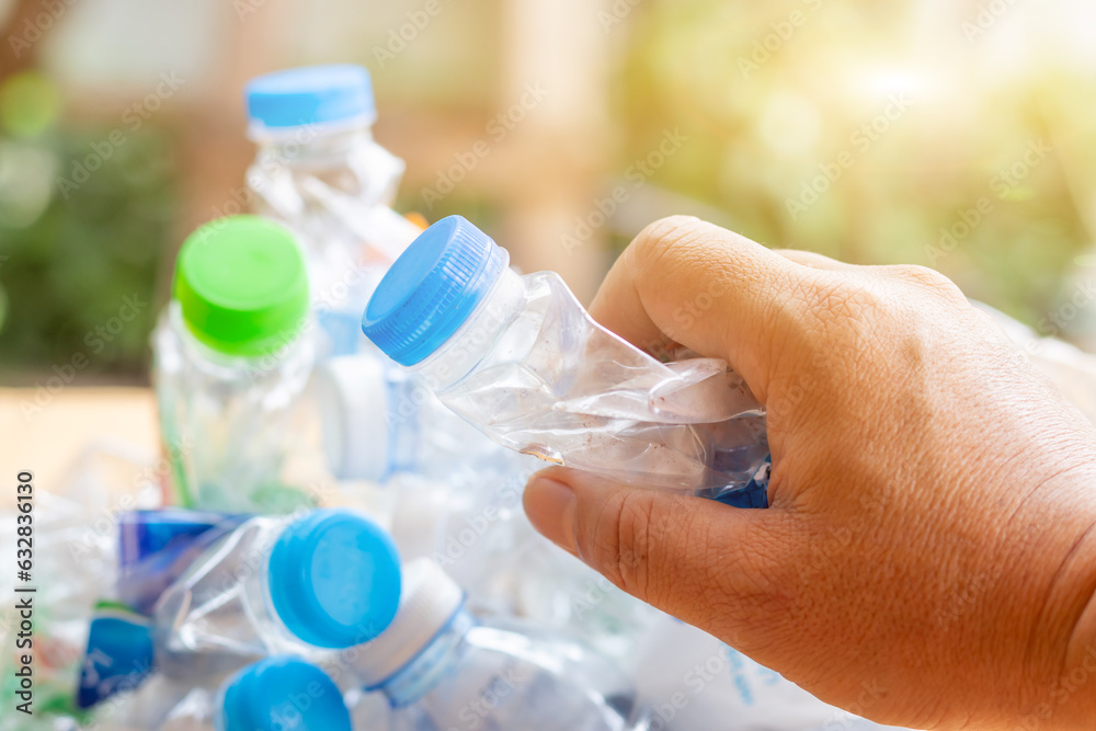 Hand hold old plastic bottles and containers set for recycling,Rubbish, rubbish, garbage, plastic waste, plastic waste pollution Hand hold old plastic bottles and containers set for recycling,Rubbish, rubbish, garbage, plastic waste, plastic waste pollution