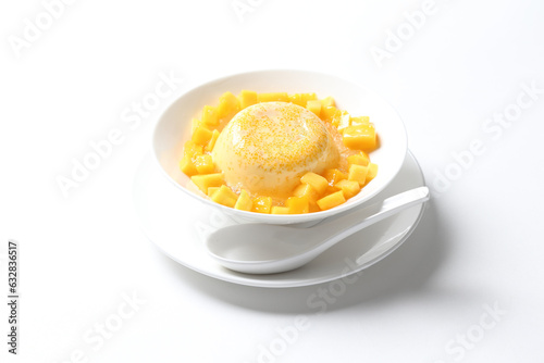 chilled mango sago fruit with pomelo and soya pudding jelly in white bowl on clean background sweet dessert pastry menu for Hong Kong cafe