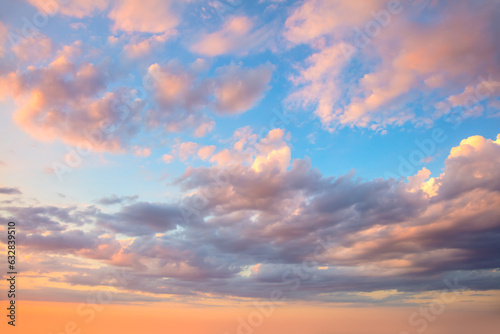 Amazing real sky - Gentle colors Panoramic Sunrise Sundown Sanset Sky with colorful clouds. Without any birds. Large panoramic sky with sun. Cloudscape © Taiga