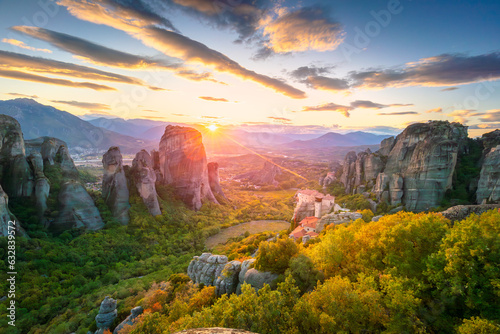 Meteora, Greece. Panoramic landscape of Meteora, Greece at romantic sundown time with real sun and sunset sky. Meteora 