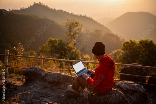Traveler use laptops connect to the 5G network for work on holidays