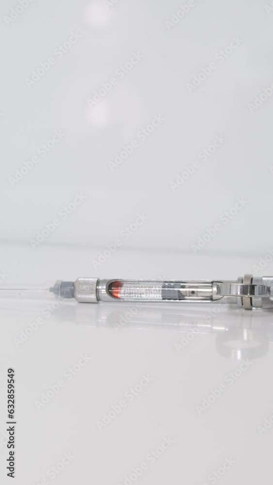 female hand takes a carpool syringe from a white background nurse anesthetist doctor Surgeon doctor preparing injection carpulse syringe female hand takes a carpool syringe from a white background nurse anesthetist doctor Surgeon doctor preparing injection carpulse syringe