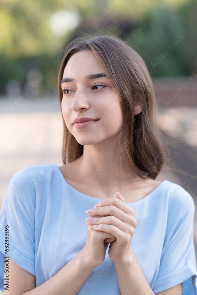 Portrait of an Armenian brunette girl in elegant blue clothes on a sunny summer day. Portrait of an Armenian brunette girl in elegant blue clothes on a sunny summer day.