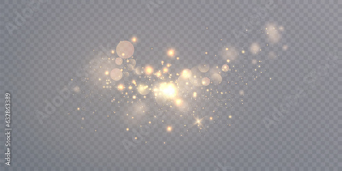 The light of gold dust. Bokeh light lights effect background. Christmas glowing background dust glows with bokeh light