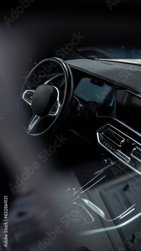 Black luxurious cockpit of a modern car. Interior of a new car.