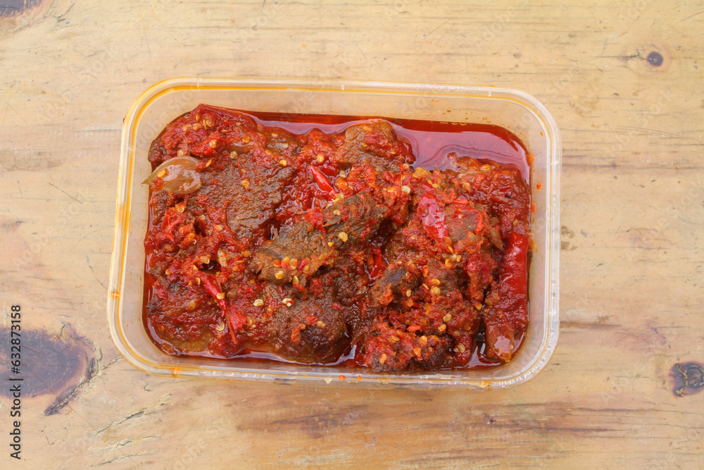Dendeng Balado or Dendeng Batokok, and is a speciality from Padang, West Sumatra, Indonesia. Made from beef which is thinly cut then dried and fried before adding chillies and other ingredients
Dendeng Balado or Dendeng Batokok, and is a speciality from Padang, West Sumatra, Indonesia. Made from beef which is thinly cut then dried and fried before adding chillies and other ingredients