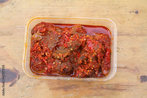 Dendeng Balado or Dendeng Batokok, and is a speciality from Padang, West Sumatra, Indonesia. Made from beef which is thinly cut then dried and fried before adding chillies and other ingredients
 photo
