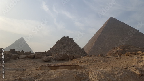  two large pyramids in the desert with rocks