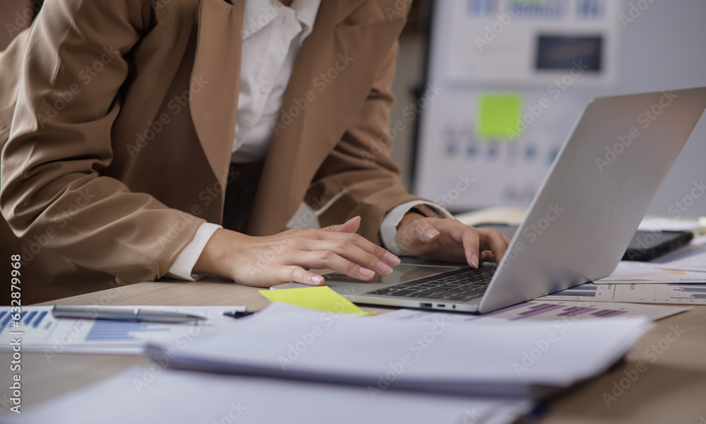 Business hands using laptop computer with document analysis data statistics on office desk. business documents and graph financial diagram. Business hands using laptop computer with document analysis data statistics on office desk. business documents and graph financial diagram.