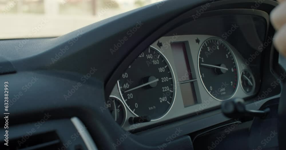 Close-up of the car speedometer, the arrow rises to the top of the acceleration. female hands on the steering wheel of a trip. High quality 4k footage Close-up of the car speedometer, the arrow rises to the top of the acceleration. female hands on the steering wheel of a trip. High quality 4k footage