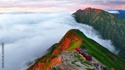 Aerial view of beautiful foggy morning in Japanese Alps, hiking in Japan, establishing shot of epic morning in the mountains