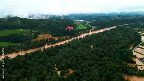 Horrific Aerial 4K Drone footage of Castle Borl and flooded villages in Podravje, Slovenia, during August. The  powerful Drava River causing extensive floods. All shots were taken during the day. photo