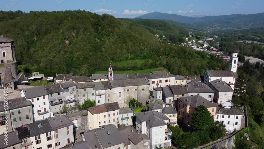 Aerial shot of Compiano medieval village and the castle on the hill from above. Compiano, Parma, Emilia-Romagna, Italy, 2022 Aerial shot of Compiano medieval village and the castle on the hill from above. Compiano, Parma, Emilia-Romagna, Italy, 2022