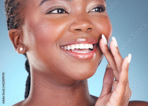 Face of black woman for makeup  beauty and lips on blue background for wellness  health and spa. Salon aesthetic  dermatology and closeup of happy person in studio with cosmetics  skincare and glow
