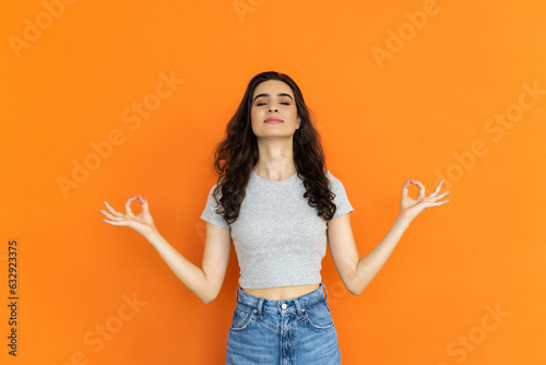 Relaxed woman meditating on bright background, yoga techniques, concentration