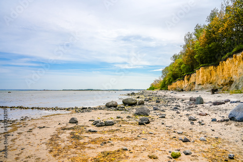 Fototapeta Naklejka Na Ścianę i Meble -  View of the steep coast at Gollwitzer Strand. Natural beach near Gollwitz in the nature reserve on the island of Poel. Landscape at the Baltic Sea.
