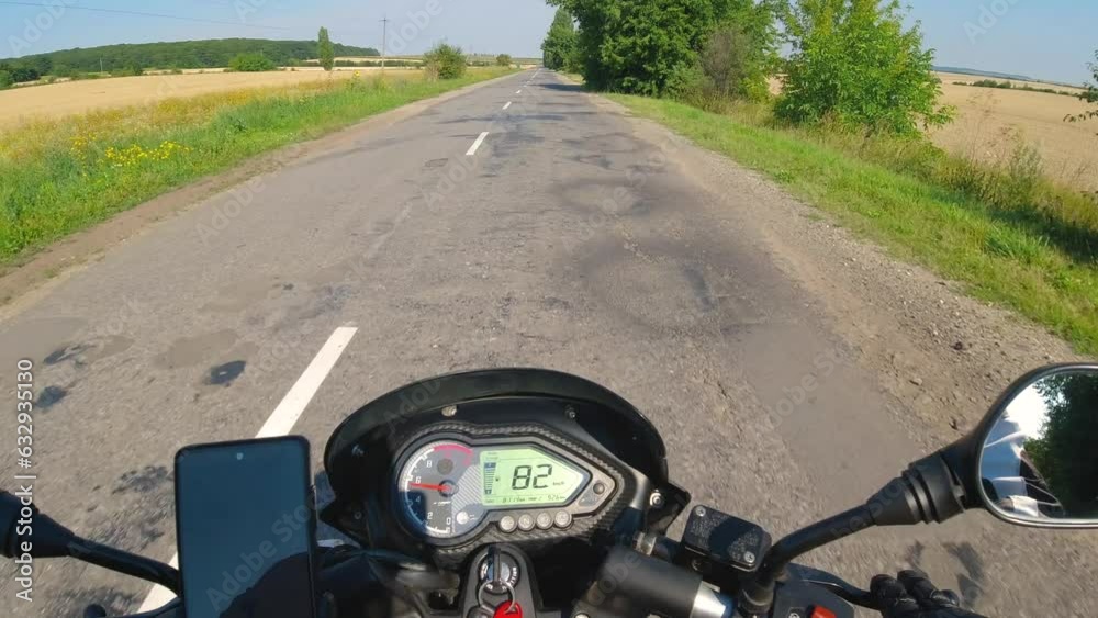 Motorcycle riding on the asphalt road, moto traveling in the summer, first person point of view, pov