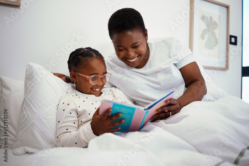 Obraz na plátně Relax, storytelling and book with mother and daughter in bedroom for education, fantasy and bedtime