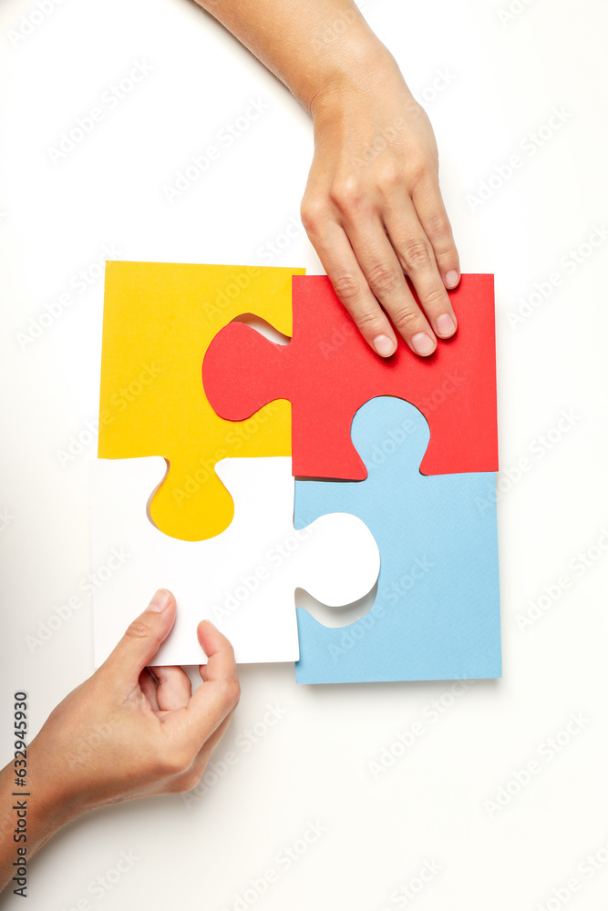 Four puzzle pieces on white background. World autism day concept Four puzzle pieces on white background. World autism day concept
