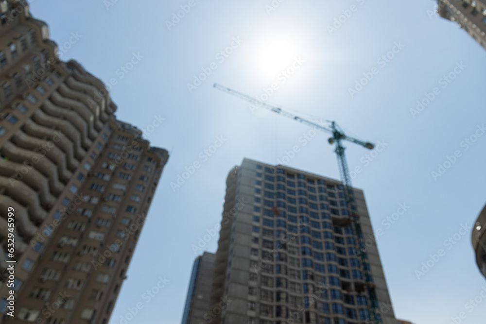 High-rise building in the city, construction on a sunny day High-rise building in the city, construction on a sunny day