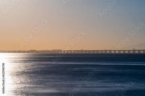 Majestic Long Exposure Shot of Niteroi Bridge at Dusk with Smooth Water