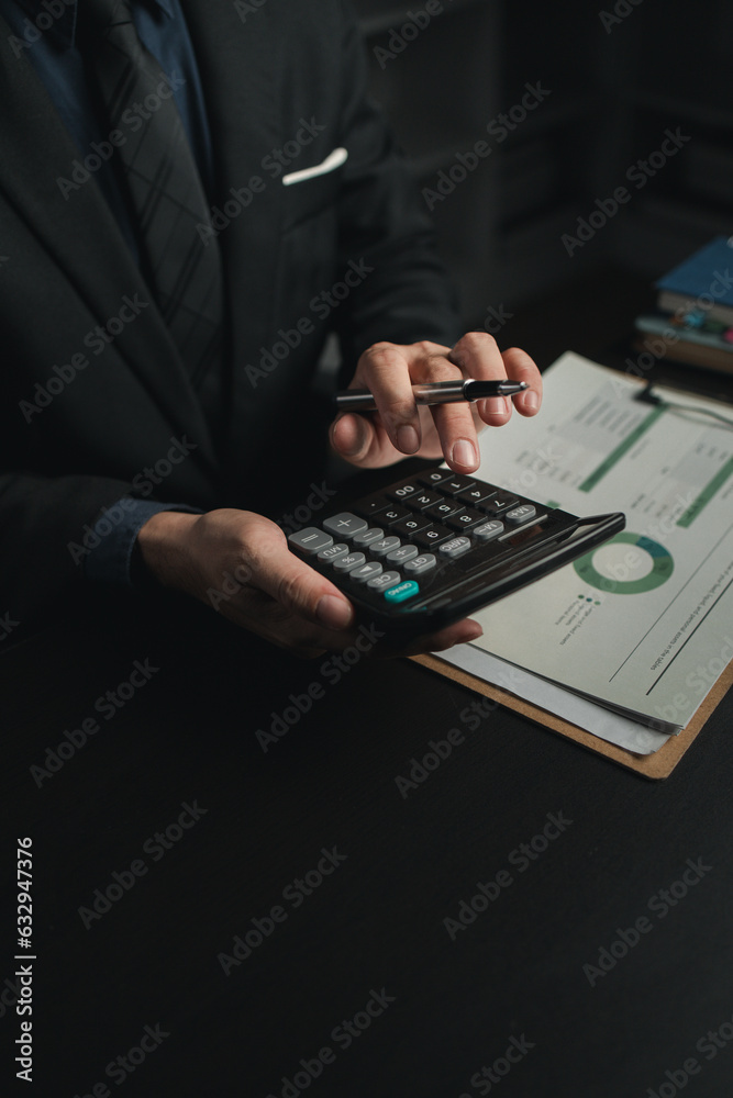 Businessman in the office in the middle of the night, he works overtime at a startup company, he is working hard and overtime. Overtime concept. Employees of private companies. working at night. Businessman in the office in the middle of the night, he works overtime at a startup company, he is working hard and overtime. Overtime concept. Employees of private companies. working at night.
