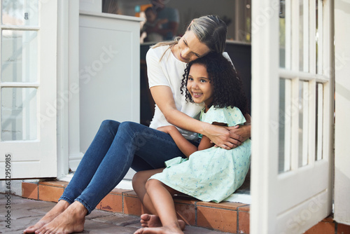 Adoption, mom and child together for hug, support or love in family home of girl in foster care with a smile of happiness. Interracial, mother and daughter bonding in embrace or playing outdoor
