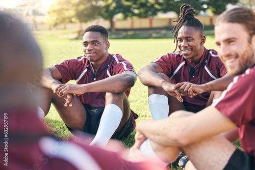 Sports  rugby and men on grass for rest at training  practice and exercise workout for match. Fitness  teamwork and male people relax for planning strategy for competition  challenge or game on field