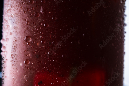 Classic alcoholic cocktail bloody mary. Macro shot of drops on a glass of cocktail photo