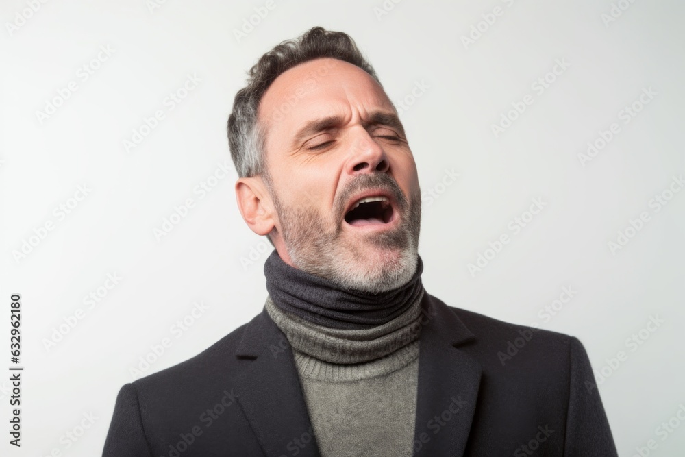 Group portrait photography of a man in his 40s grimacing and touching his throat due to strep throat wearing a chic cardigan against a white background Group portrait photography of a man in his 40s grimacing and touching his throat due to strep throat wearing a chic cardigan against a white background