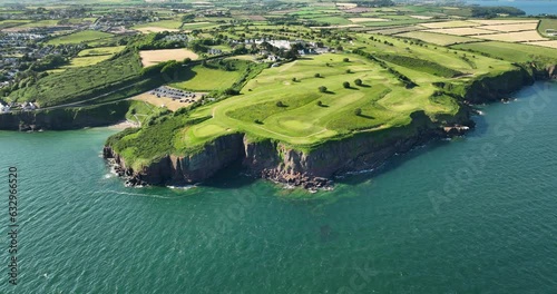 Incredible golf course on a rocky bluff near the ocean 4k photo