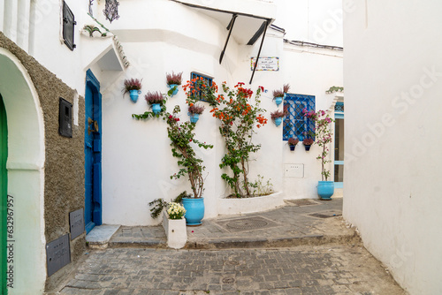 Narrow alley with stairs and houses painted white at Ksbah, Ancient Medina, Tangier, Morocco