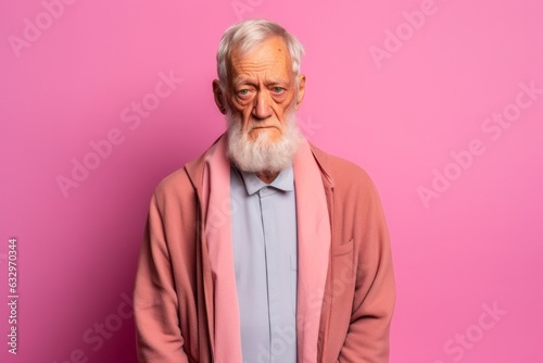 Lifestyle portrait photography of a man in his 70s with a confused and distant expression due to Alzheimer disease wearing hijab against a pastel or soft colors background 