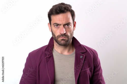 Medium shot portrait photography of a man in his 30s with a pained and tired expression due to fibromyalgia wearing a chic cardigan against a white background 