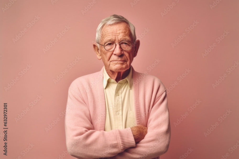 Medium shot portrait photography of a man in his 80s with a hint of fatigue due to chronic kidney disease wearing a chic cardigan against a pastel or soft colors background Medium shot portrait photography of a man in his 80s with a hint of fatigue due to chronic kidney disease wearing a chic cardigan against a pastel or soft colors background